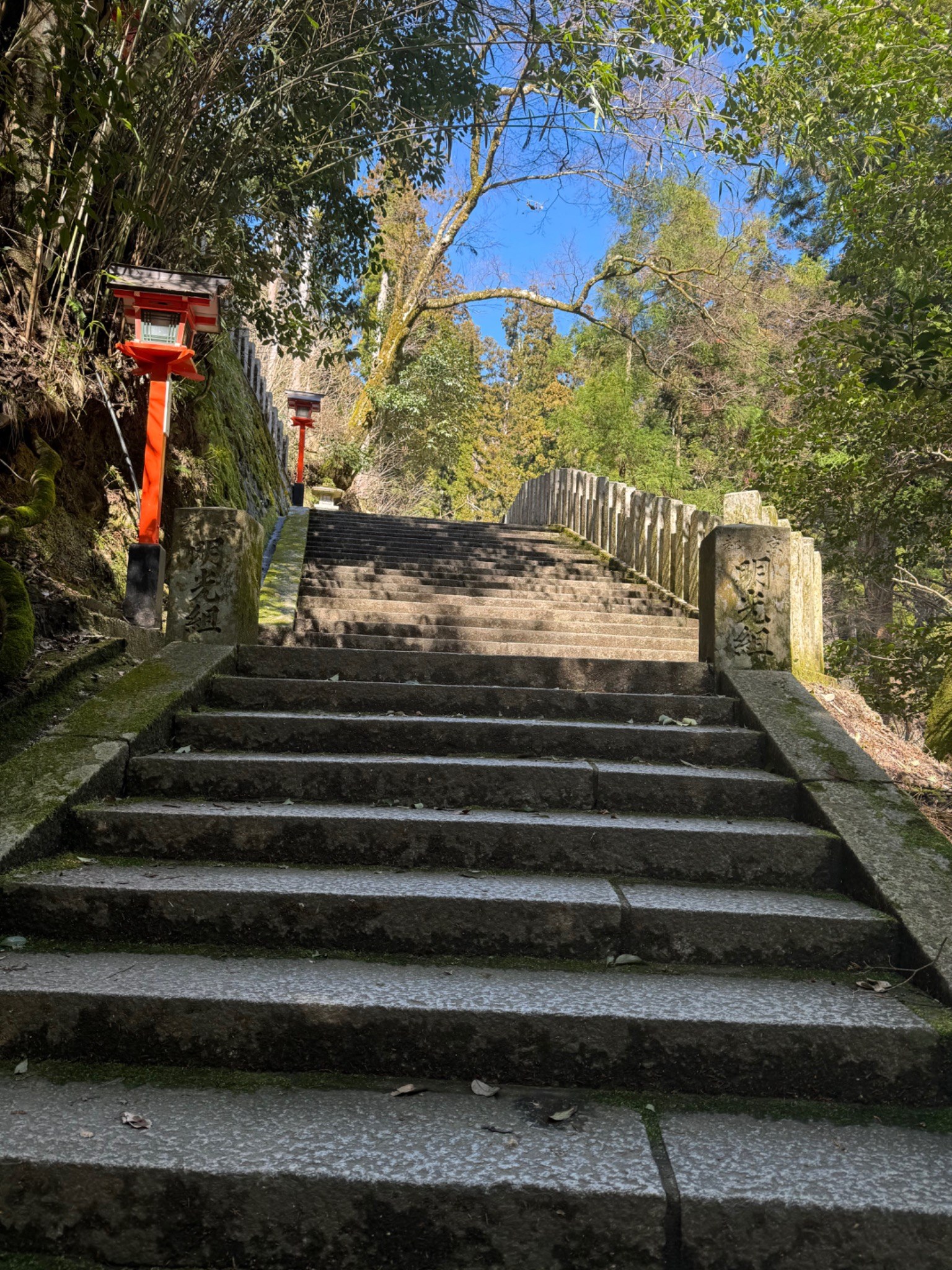Stone steps and red lanterns on Mount Kurama